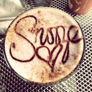 hot chocolate with "snoozed" written in chocolate syrup.